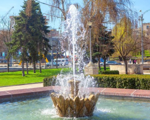 splashing city fountain in the summer